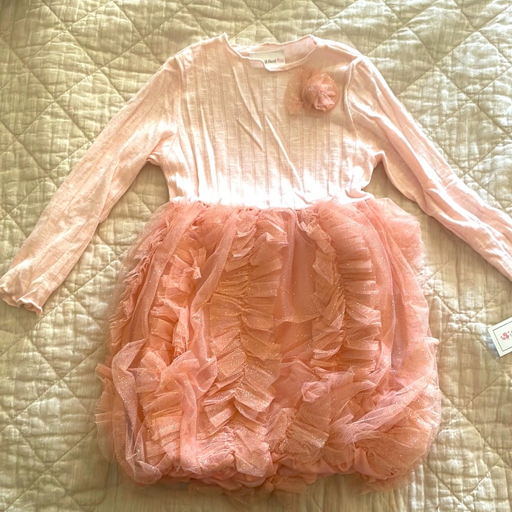 Girls pink dress with sparkly bell skirt.